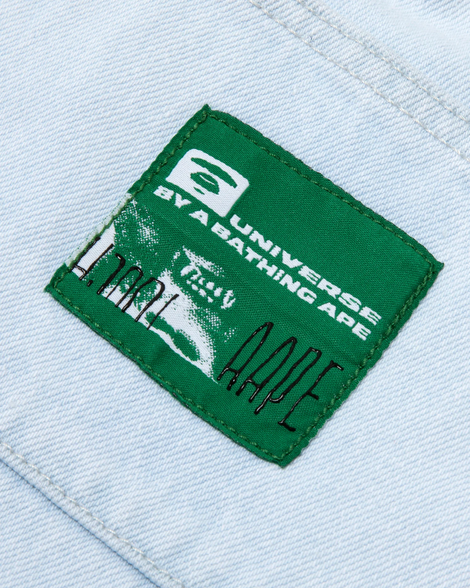Moonface embroidered denim pants - Image 4