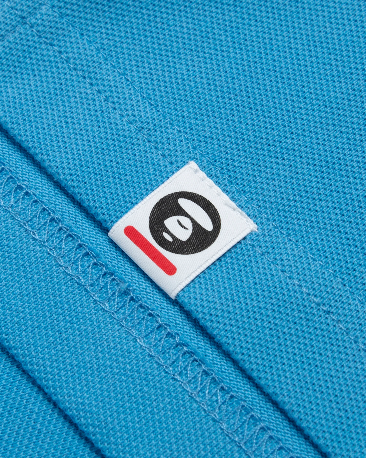 Moonface embroidered twin tipped polo - Image 15