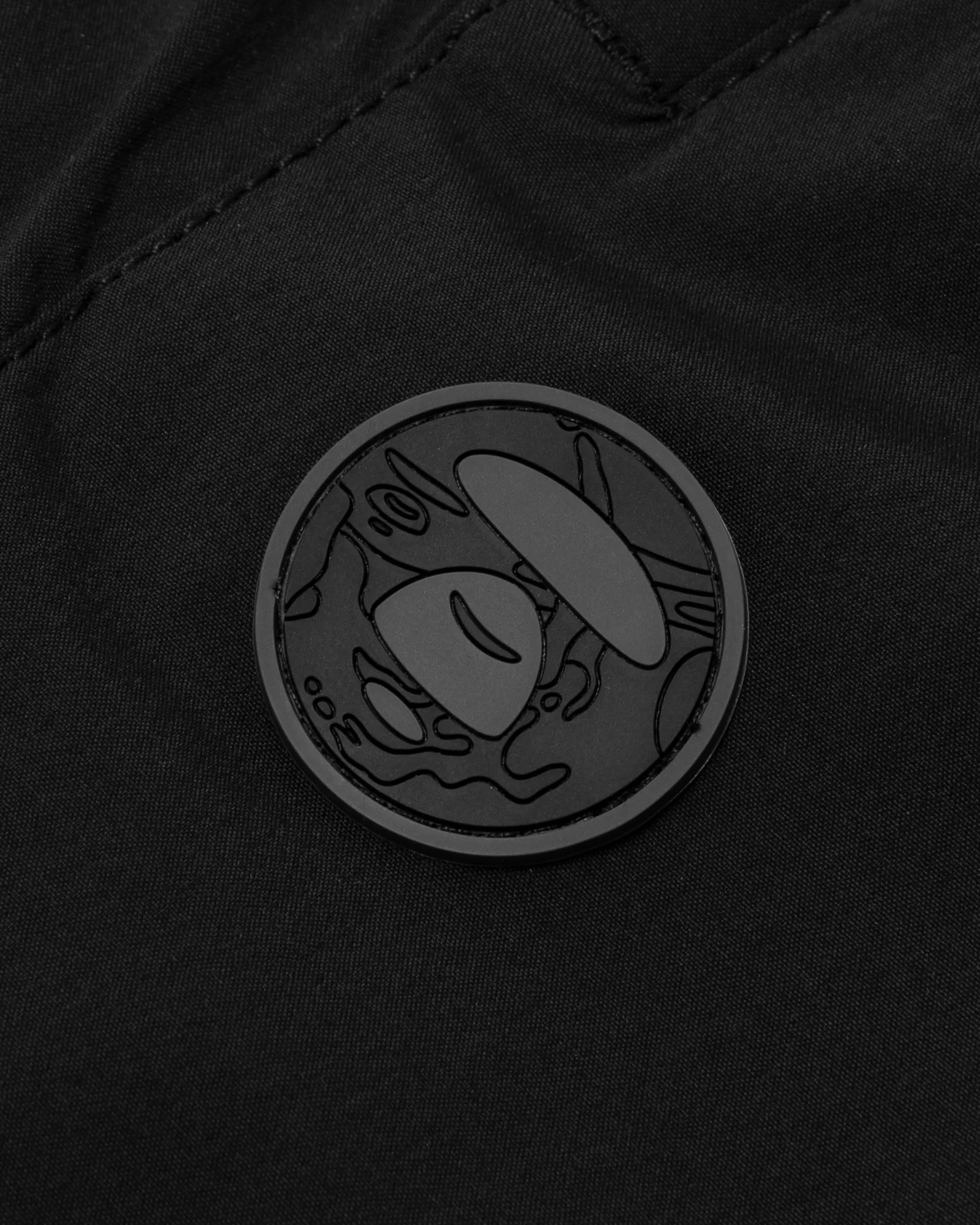 Moonface patch nylon pants - Image 9