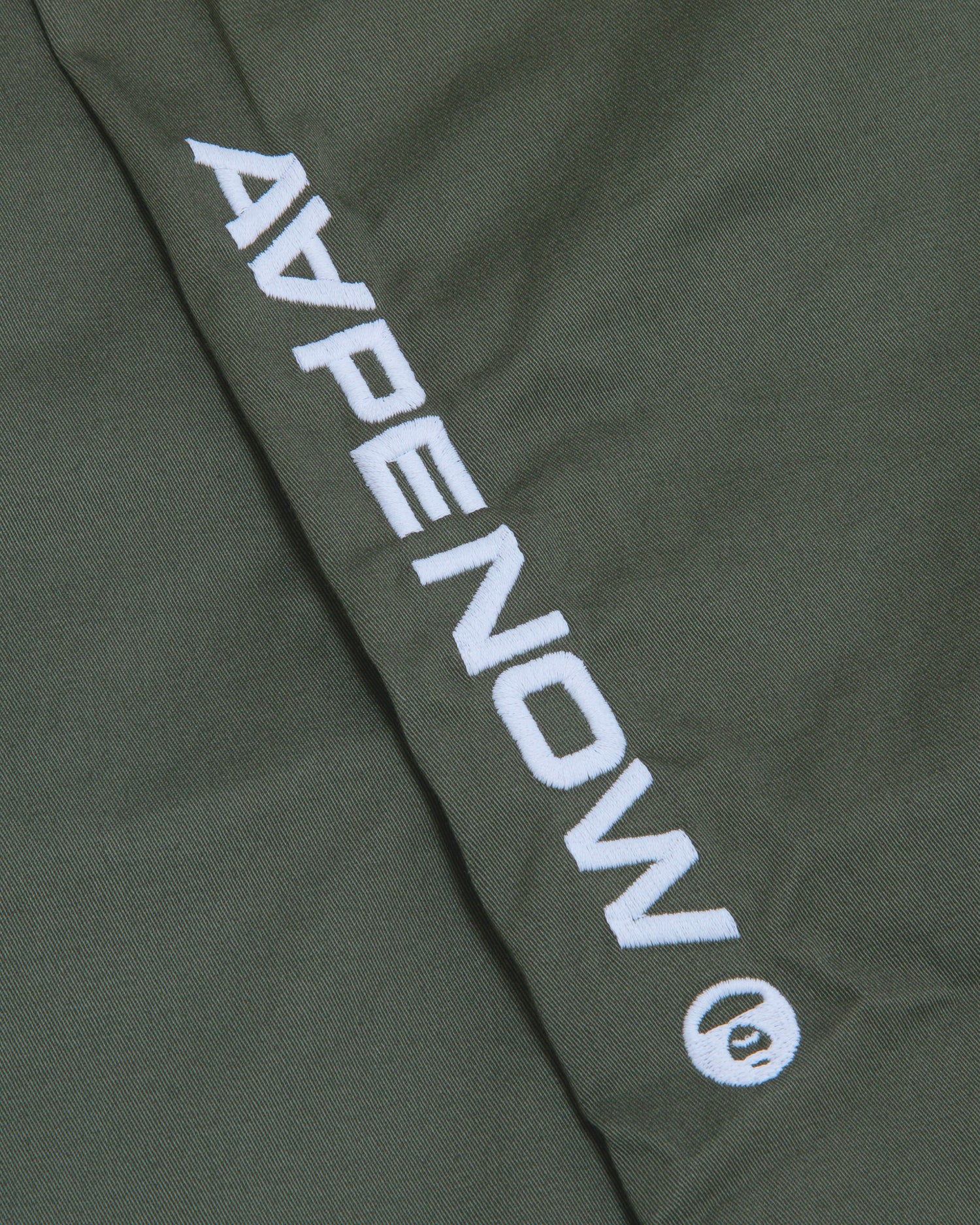 Moonface patch chino pants - Image 14