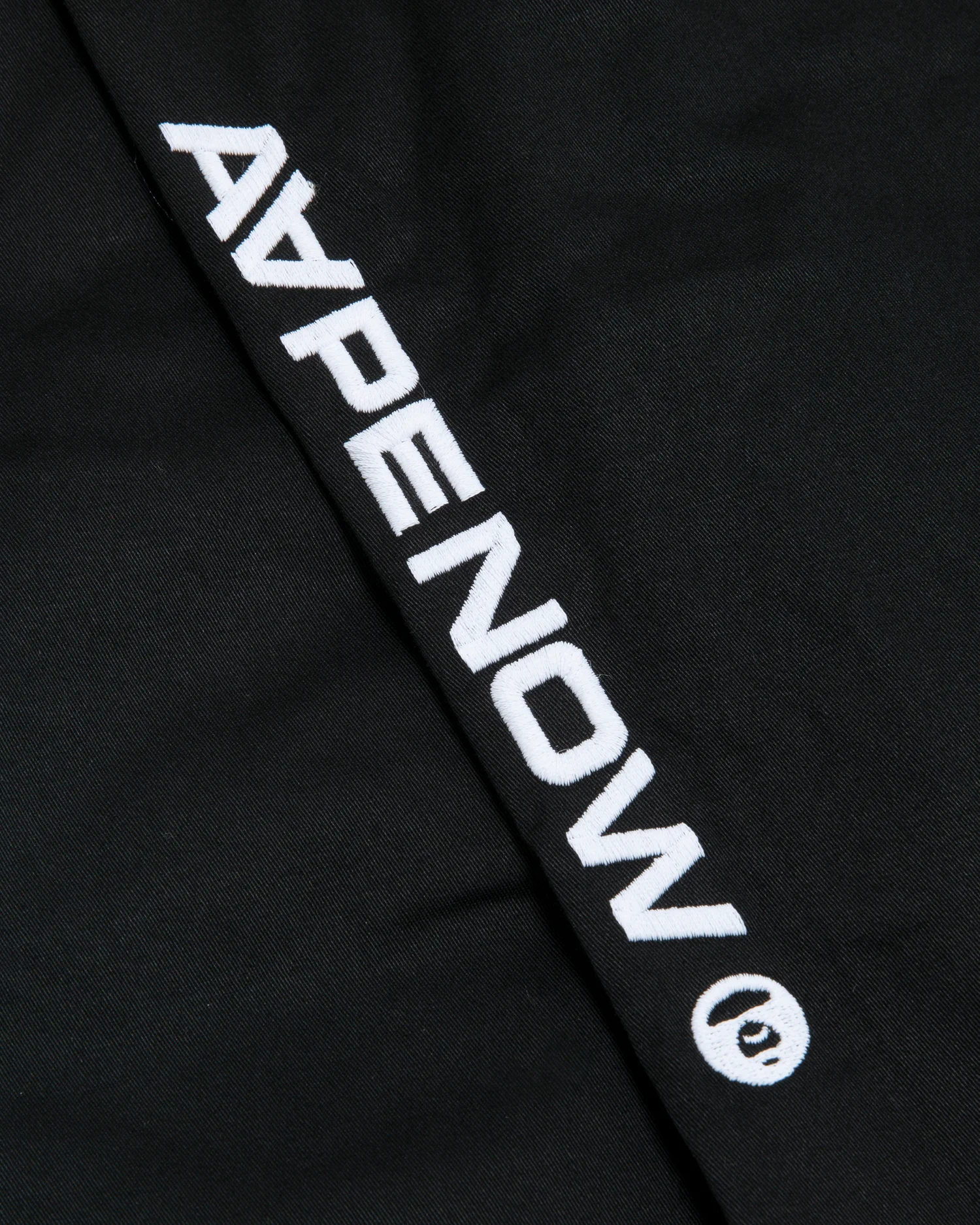 Moonface patch chino pants - Image 9